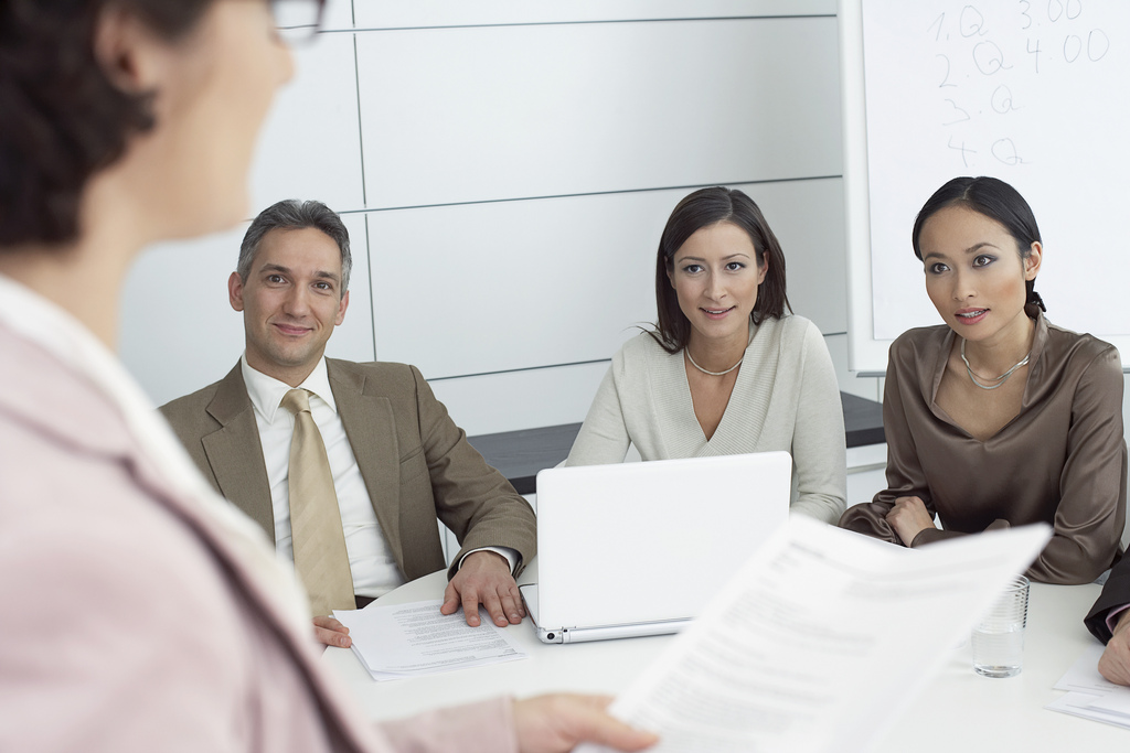 Co-workers in a meeting --- Image by © Nic Ortega/Corbis